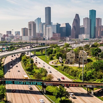 Houston Skyline with Be Someone Text