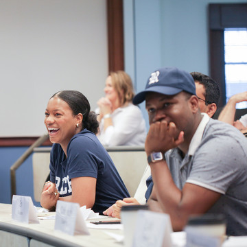 Focus is on two students in a classroom