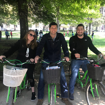 Three Rice MBA students on bikes during their Global Field Experience