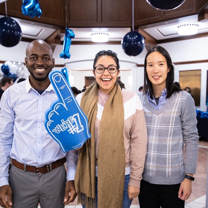 Three Rice MBA students showcasing Rice’s #1 entrepreneurship rank using hand foam